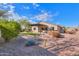 Artificial turf and desert landscaping in backyard at 42521 W Sea Eagle Dr, Maricopa, AZ 85138