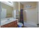 Bathroom with shower/tub combo and wood vanity at 42521 W Sea Eagle Dr, Maricopa, AZ 85138