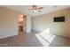 Bright bedroom with wood-look flooring and a ceiling fan at 42521 W Sea Eagle Dr, Maricopa, AZ 85138