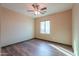 Bedroom with wood-look floors and ceiling fan at 42521 W Sea Eagle Dr, Maricopa, AZ 85138