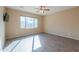 Bedroom with wood-look flooring and a ceiling fan at 42521 W Sea Eagle Dr, Maricopa, AZ 85138