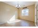 Bright dining room with tile floor and chandelier at 42521 W Sea Eagle Dr, Maricopa, AZ 85138