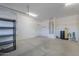 Garage with shelving, water heater, and storage at 42521 W Sea Eagle Dr, Maricopa, AZ 85138