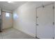 Spacious garage with extra storage space and door at 42521 W Sea Eagle Dr, Maricopa, AZ 85138