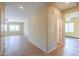 Interior hallway with tile floors and doors to rooms at 42521 W Sea Eagle Dr, Maricopa, AZ 85138