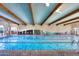 Inviting indoor pool with lap lanes and comfortable seating at 42521 W Sea Eagle Dr, Maricopa, AZ 85138