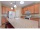 Modern kitchen with granite countertops and stainless steel appliances at 42521 W Sea Eagle Dr, Maricopa, AZ 85138