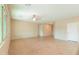 Spacious living room with tile flooring and neutral walls at 42521 W Sea Eagle Dr, Maricopa, AZ 85138