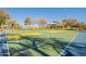 Community basketball court with two hoops at 43808 W Wade Dr, Maricopa, AZ 85138