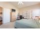 Bright bedroom with window, workspace and built-in storage at 43808 W Wade Dr, Maricopa, AZ 85138