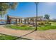 Relaxing community gazebo with picnic tables near lake at 43808 W Wade Dr, Maricopa, AZ 85138