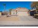 Single-story home with desert landscaping and a two-car garage at 43808 W Wade Dr, Maricopa, AZ 85138