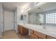 Double vanity bathroom with large mirror and shower at 4444 E Peach Tree Dr, Chandler, AZ 85249