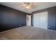 Spacious bedroom with ceiling fan and large closet at 4444 E Peach Tree Dr, Chandler, AZ 85249