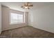 Charming bedroom with bay window and ceiling fan at 4444 E Peach Tree Dr, Chandler, AZ 85249