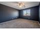 Well-lit bedroom with a ceiling fan and window at 4444 E Peach Tree Dr, Chandler, AZ 85249