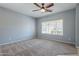 Spacious bedroom with ceiling fan and large window with blinds at 4444 E Peach Tree Dr, Chandler, AZ 85249