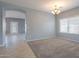 Bright dining area with arched entryway, chandelier, and window with blinds at 4444 E Peach Tree Dr, Chandler, AZ 85249