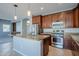 Spacious kitchen with granite countertops, stainless steel appliances, and wood cabinets at 4444 E Peach Tree Dr, Chandler, AZ 85249