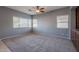 Bright living room with neutral walls, ceiling fan, and carpet flooring at 4444 E Peach Tree Dr, Chandler, AZ 85249