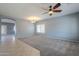 Open living room with tile and carpeted floors and a ceiling fan at 4444 E Peach Tree Dr, Chandler, AZ 85249