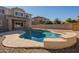 Relaxing kidney-shaped pool with a stone deck at 4444 E Peach Tree Dr, Chandler, AZ 85249