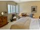 Bedroom with built-in seating and access to patio at 4800 N 68Th St # 349, Scottsdale, AZ 85251