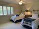 Charming bedroom with two twin beds and an exposed brick wall at 4800 N 68Th St # 349, Scottsdale, AZ 85251