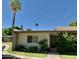 Tan brick home with gray door and desert landscaping at 4800 N 68Th St # 349, Scottsdale, AZ 85251