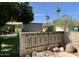 Landscaped yard with a brick wall and wrought iron fence at 4800 N 68Th St # 349, Scottsdale, AZ 85251