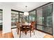 Bright dining room featuring a wood table and chairs near a balcony at 4808 N 24Th St # 921, Phoenix, AZ 85016