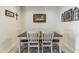 Charming dining room with a farmhouse table and wall art at 4916 E Rhodium Dr, San Tan Valley, AZ 85143