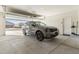 Open garage with car parked, showing a view of the neighborhood at 4916 E Rhodium Dr, San Tan Valley, AZ 85143