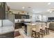 Spacious kitchen with an island, stainless steel appliances, and dark cabinets at 4916 E Rhodium Dr, San Tan Valley, AZ 85143