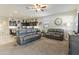 Spacious living room with gray couches and a view of the kitchen at 4916 E Rhodium Dr, San Tan Valley, AZ 85143