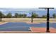 New Sport Court with basketball hoops and freshly painted lines at 4916 E Rhodium Dr, San Tan Valley, AZ 85143