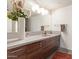 Modern bathroom with a sleek vanity and a large mirror at 535 W Thomas Rd # 208, Phoenix, AZ 85013