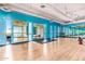 Spacious gym with hardwood floors, blue walls, mirrors, and exercise equipment, designed for fitness and wellness at 535 W Thomas Rd # 208, Phoenix, AZ 85013