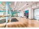 Bright, modern gym featuring hardwood floors, mirrored walls, and fitness equipment at 535 W Thomas Rd # 208, Phoenix, AZ 85013