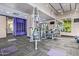 Modern gym with fitness equipment, including weight machines and a mirrored wall at 535 W Thomas Rd # 208, Phoenix, AZ 85013