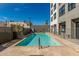 Inviting rectangular pool with surrounding lounge chairs at 535 W Thomas Rd # 208, Phoenix, AZ 85013