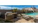 Relaxing pool area with grill, lounge chairs, and pool at 535 W Thomas Rd # 208, Phoenix, AZ 85013