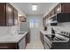 Modern kitchen with stainless steel appliances and light cabinets at 540 S West Rd # 12, Wickenburg, AZ 85390