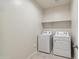 Laundry room with washer, dryer, and shelving at 5515 E Rock Bush Ln, San Tan Valley, AZ 85140