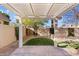 Landscaped backyard with pergola and artificial turf at 5534 N 15Th St, Phoenix, AZ 85014