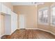 Bright bedroom with wood flooring and plantation shutters at 5534 N 15Th St, Phoenix, AZ 85014