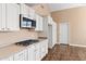 White kitchen with stainless steel appliances and gas cooktop at 5534 N 15Th St, Phoenix, AZ 85014