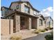 Two-story house with stone accents and a covered porch at 5704 E Butte St, Mesa, AZ 85205