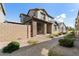 Exterior of home with walkway and patio seating at 5704 E Butte St, Mesa, AZ 85205