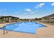 Community pool with lounge chairs and covered seating at 5704 E Butte St, Mesa, AZ 85205